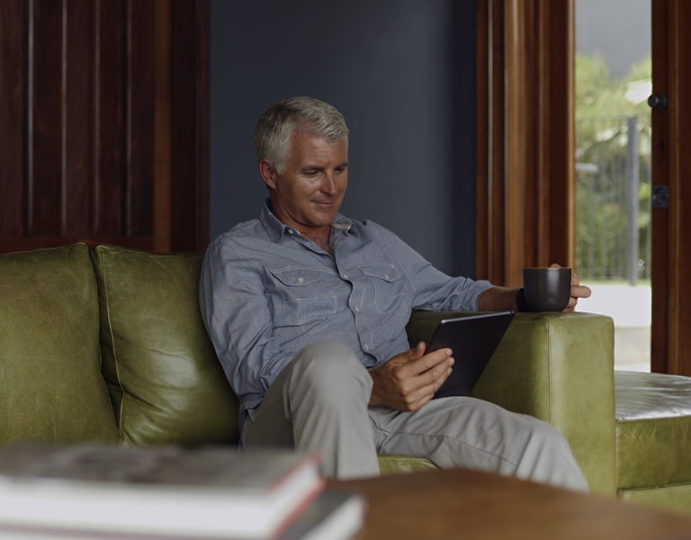 Financial planning image of a person drinking a cup of coffee