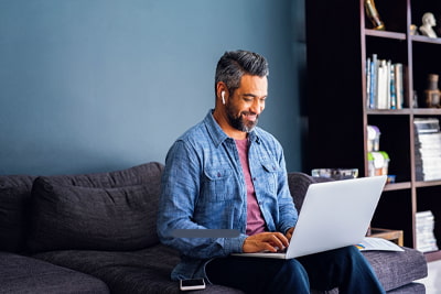 Pre-retirement advice image of a person smiling in a coffee shop