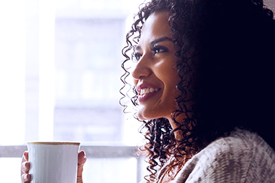 wealth management image of someone looking out their window