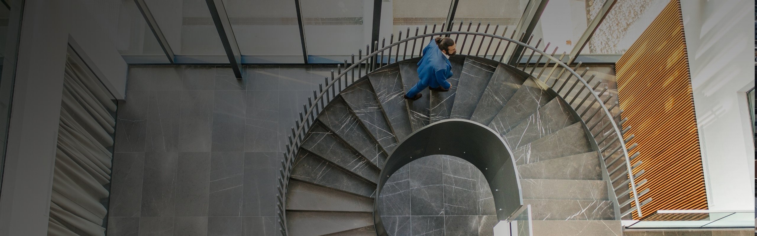 Businessman on spiral staircase