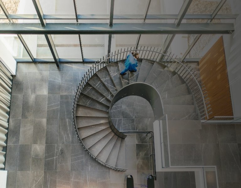 Businessman on spiral staircase