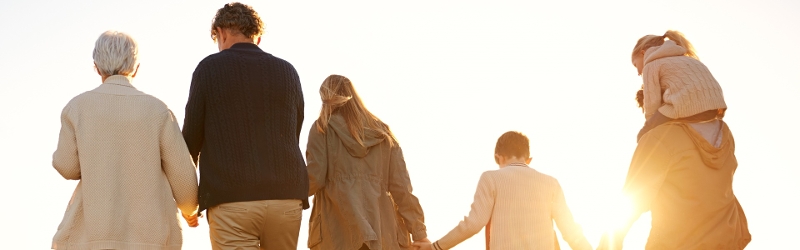Northern Ireland Inheritance Tax image of family walking towards sunset