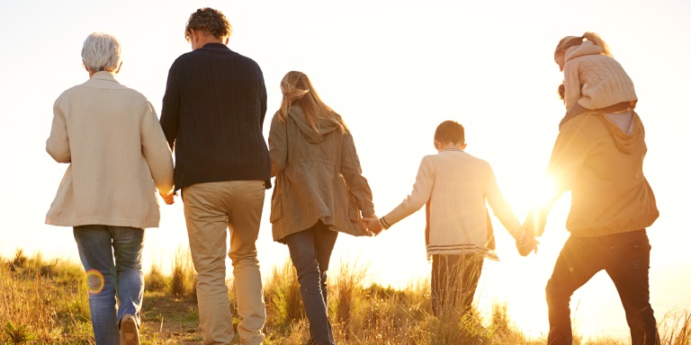Northern Ireland Inheritance Tax image of family walking towards sunset